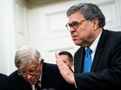 William Bar gestures while speaking to someone out of frame