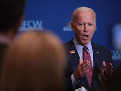 Former vice president Joe Biden speaks to the press after addressing the United Food and Commercial Workers' 2020 presidential candidate forum on October 13, 2019, in Altoona, Iowa.