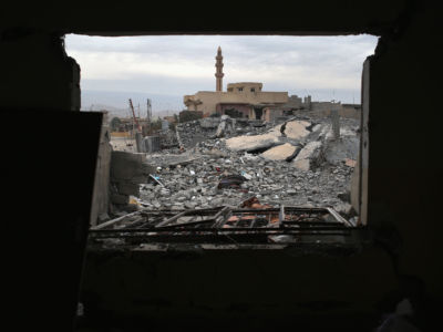 A Kurdish Peshmerga soldier searches through the rubble of an airstrike near a mosque on November 16, 2015, in Sinjar, Iraq. Months of U.S.-led airstrikes assisted Kurdish forces in driving out ISIS forces in the town. Although the battle was deemed a major victory, much of the city lies in complete ruins.