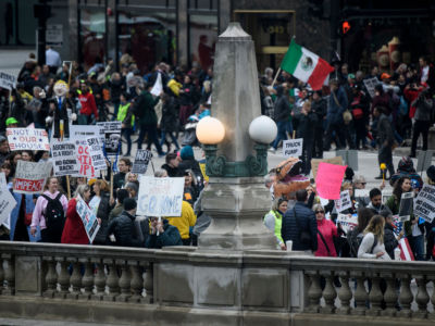 Protesters gather along the Chicago River as President Trump attends fundraisers at the Trump International Hotel & Tower Chicago on October 28, 2019, in Chicago, Illinois.