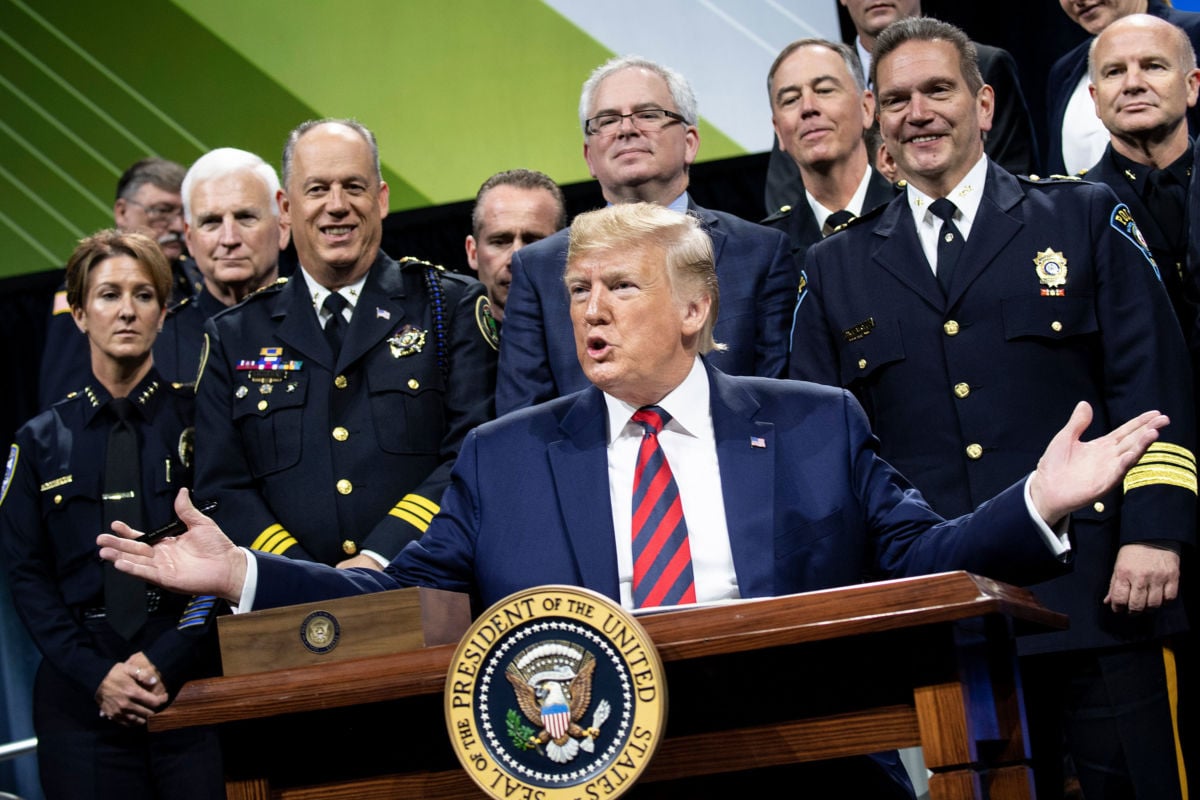 President Trump pauses while signing an executive order during the International Association of Chiefs of Police Annual Conference and Exposition at the McCormick Place Convention Center October 28, 2019, in Chicago, Illinois.