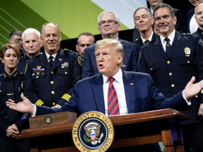 President Trump pauses while signing an executive order during the International Association of Chiefs of Police Annual Conference and Exposition at the McCormick Place Convention Center October 28, 2019, in Chicago, Illinois.