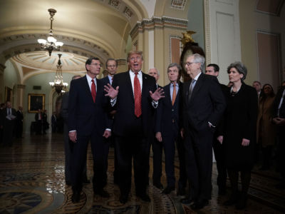 A group of Republican senators and Vice President Mike Pence listen as President Trump speaks to the media at the U.S. Capitol on January 9, 2019.