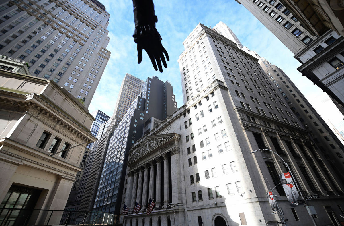 The hand of a statue of George Washington is seen in front of the New York Stock Exchange on October 11, 2019, at Wall Street in New York City.