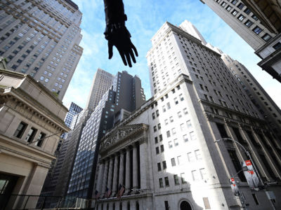 The hand of a statue of George Washington is seen in front of the New York Stock Exchange on October 11, 2019, at Wall Street in New York City.