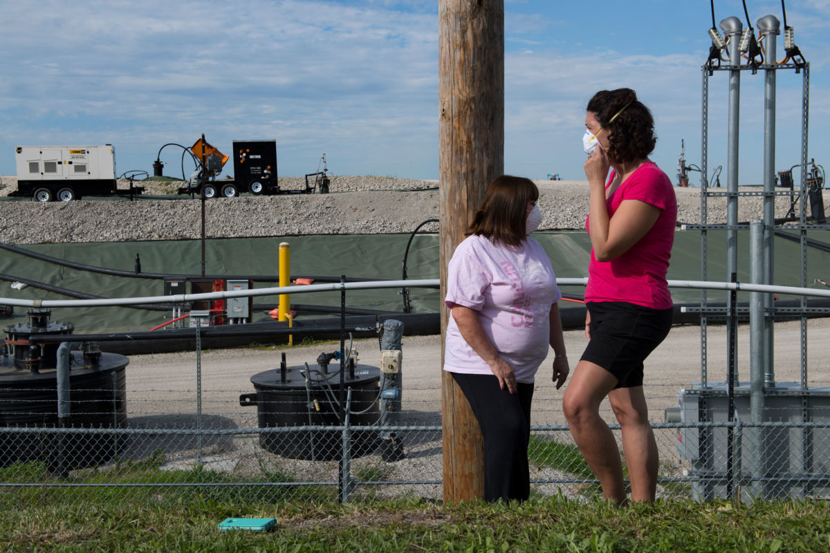 Activists Dawn Chapman (left) and Karen Nickel wear protective masks at the West Lake Landfill in greater St. Louis, Missouri on June 1, 2017.