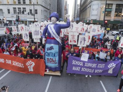 Thousands of Chicago Teachers' Union (CTU) and Service Employees International Union (SEIU) Local 73 members march through downtown Chicago to demand a budget that funds their students and classrooms, October 14, 2019.