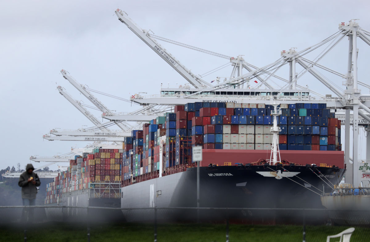 Container ships sit docked at the Port of Oakland on March 6, 2019, in Oakland, California.