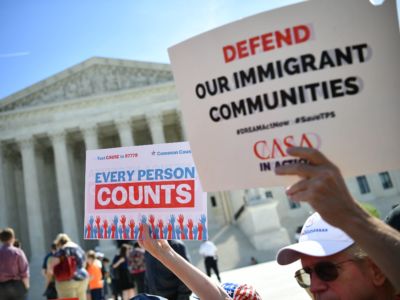 Demonstrators rally at the U.S. Supreme Court in Washington, D.C., on April 23, 2019, to protest a proposal to add a citizenship question in the 2020 Census.