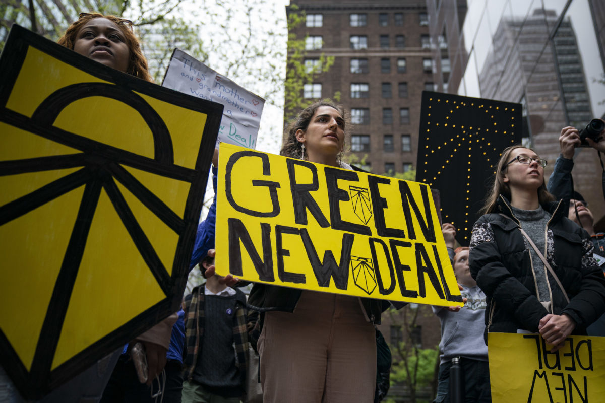 Activists rally in support of proposed "Green New Deal" legislation outside of Senate Minority Leader Chuck Schumer's New York City office, April 30, 2019.