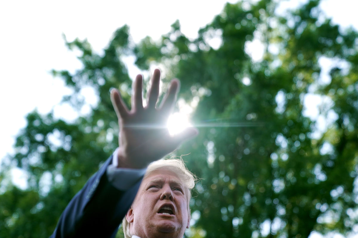 President Trump talks to journalists before boarding Marine One and departing the White House, August 2, 2019, in Washington, D.C.