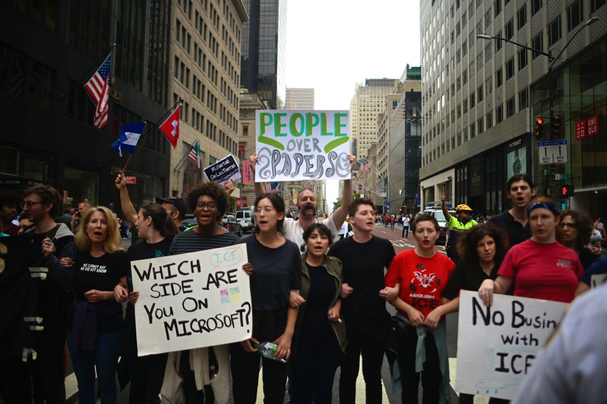 Protestors hold posters as they block a street in midtown Manhattan during a rally against U.S. immigration policy on September 14, 2019, in New York City.