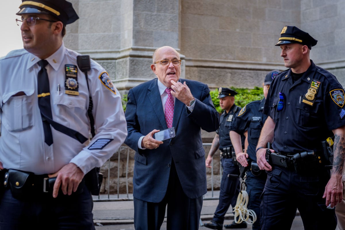 Donald Trump's lawyer Rudy Giuliani reacting to a crowd booing him in New York City, May 23, 2018.