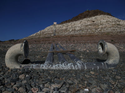 Pipes for a water intake pump sit on dry land in front of Pyramid Island near Boulder Beach on May 13, 2015, in Lake Mead National Recreation Area, Nevada.