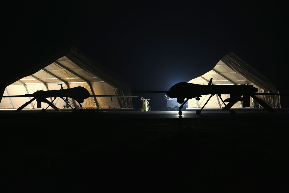 A U.S. Air Force MQ-1B Predator unmanned aerial vehicle (R) returns from a mission to an air base in the Persian Gulf region on January 7, 2016.