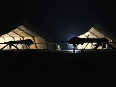 A U.S. Air Force MQ-1B Predator unmanned aerial vehicle (R) returns from a mission to an air base in the Persian Gulf region on January 7, 2016.