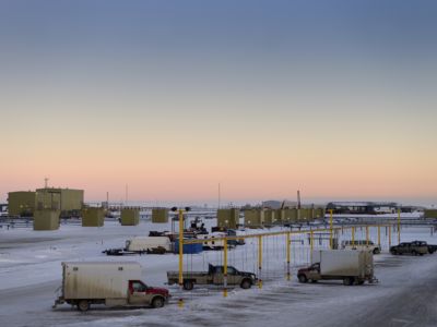 Oil wells and a truck charging station in Deadhorse, Prudhoe Bay, Alaska. The Alaska Supreme Court heard oral arguments on the constitutionality of the state's energy policy promoting development of oil and gas.