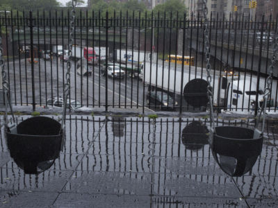 Trucks and cars drive past a children's playground on the Cross Bronx Expressway on May 25, 2017 in the Bronx, New York. The highway is one of the busiest in the nation, and the neighborhoods above it have very high levels of asthma in their communities.