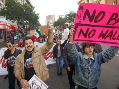 Anti-Trump demonstrators chant during a rally on March 12, 2018, in San Diego, California.