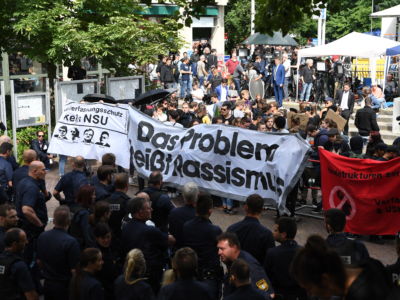 Anton 11:22 AM Anti-fascist and anti-racist activists take part in a protest outside the Higher Regional Court in Munich, Germany, on July 11, 2018.