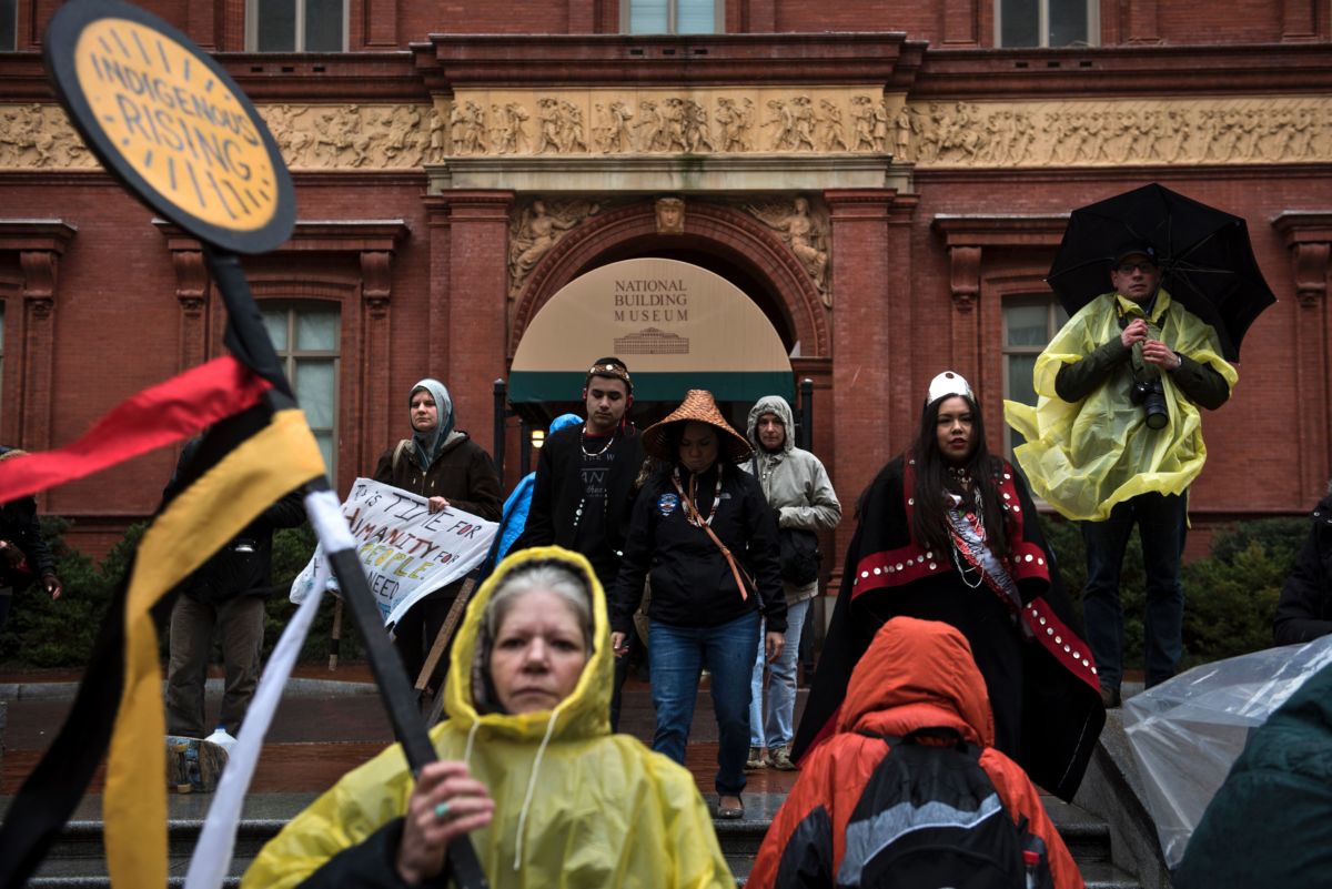 Water protectors walk away from the National Building museum