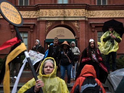 Water protectors walk away from the National Building museum