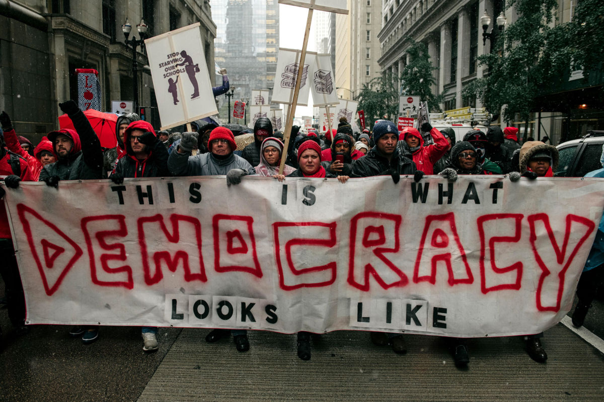 Braving snow and cold temperatures, thousands marched through the streets near City Hall during the 11th day of the teacher strike on October 31, 2019, in Chicago, Illinois.