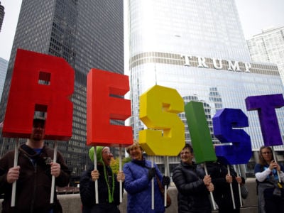 Demonstrators protest President Donald Trump's visit to Chicago outside Trump International Hotel & Tower on October 28, 2019, in Chicago, Illinois.