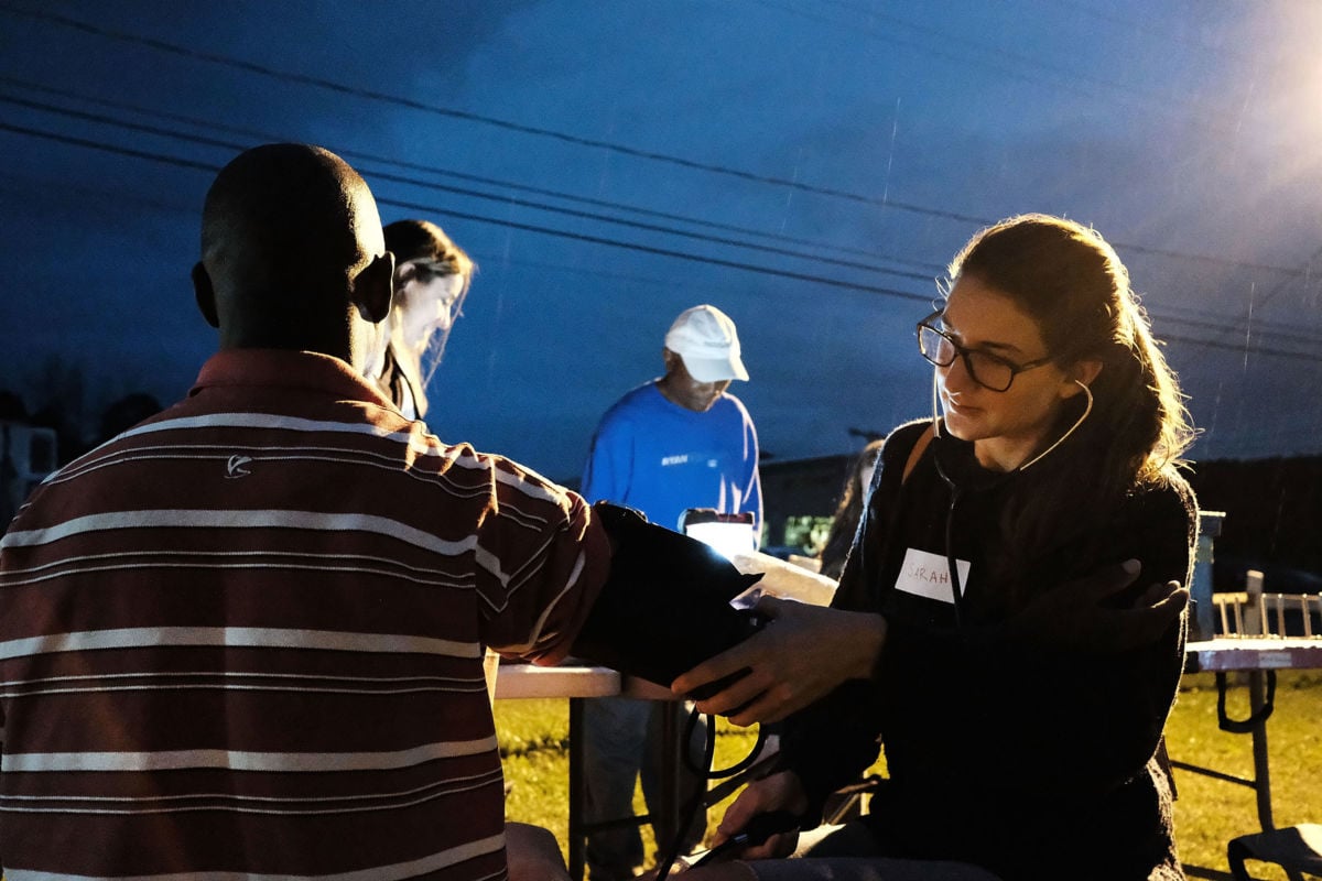 A medical student gives a check-up to a Jamaican migrant worker on a H2A visa at a Connecticut apple orchard and farm on October 11, 2017, in Middlefield, Connecticut.