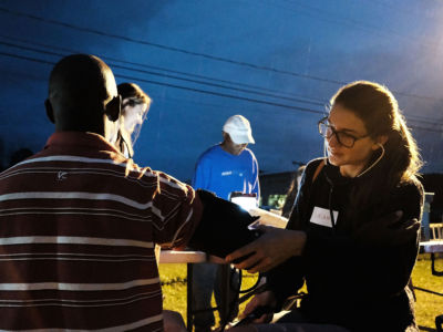 A medical student gives a check-up to a Jamaican migrant worker on a H2A visa at a Connecticut apple orchard and farm on October 11, 2017, in Middlefield, Connecticut.