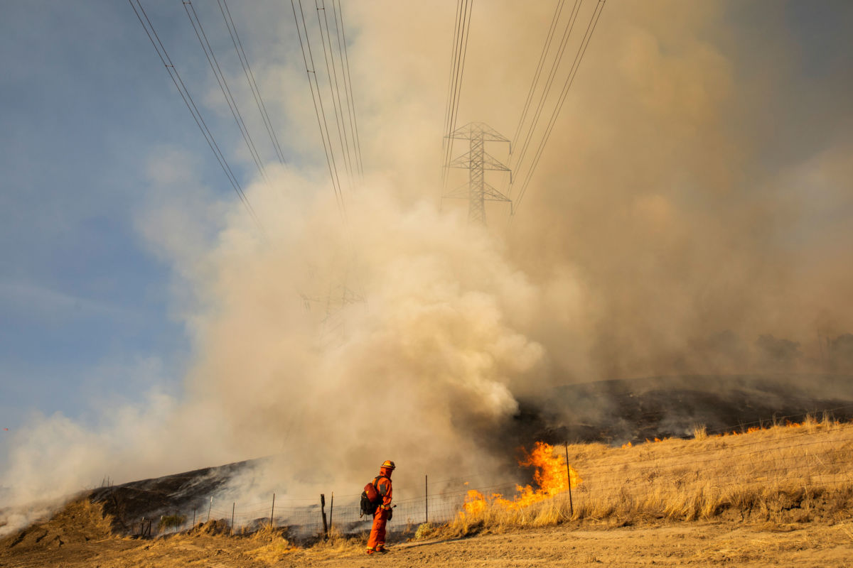 Fire fighters battle the Kincade Fire in Healdsburg, California, on October 26, 2019.