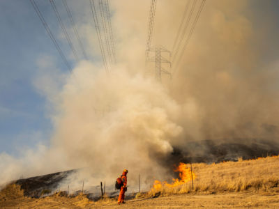 Fire fighters battle the Kincade Fire in Healdsburg, California, on October 26, 2019.