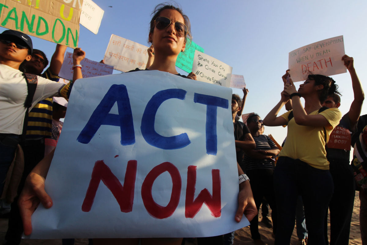 Students and people hold placards as they participate in a rally against climate change in Mumbai, India, on May 24, 2019.