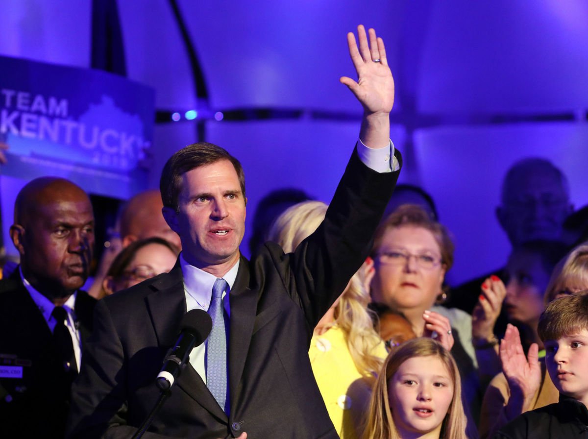 Gov.-elect Andy Beshear waves to a crowd