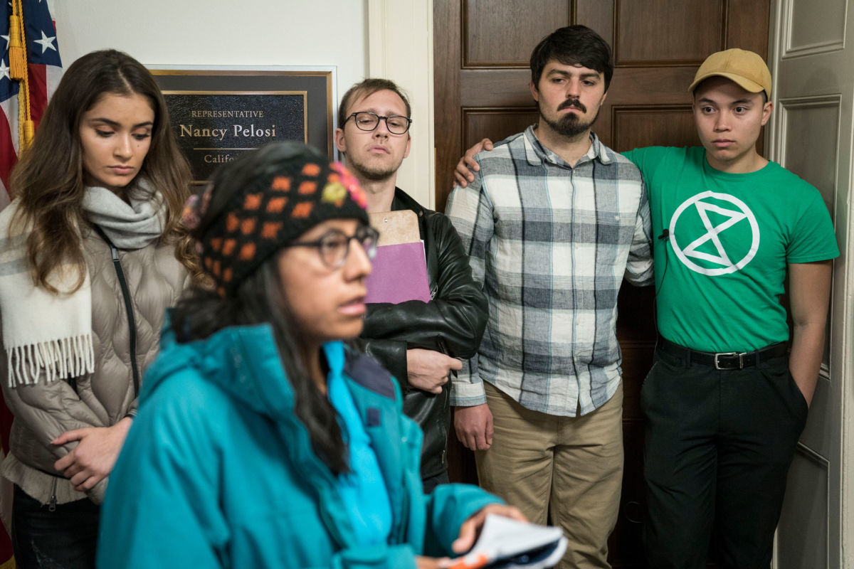 Extinction Rebellion protestors gather before beginning a hunger strike outside of House Speaker Nancy Pelosi's office in Longworth House Office Building on November 18, 2019, in Washington, D.C.