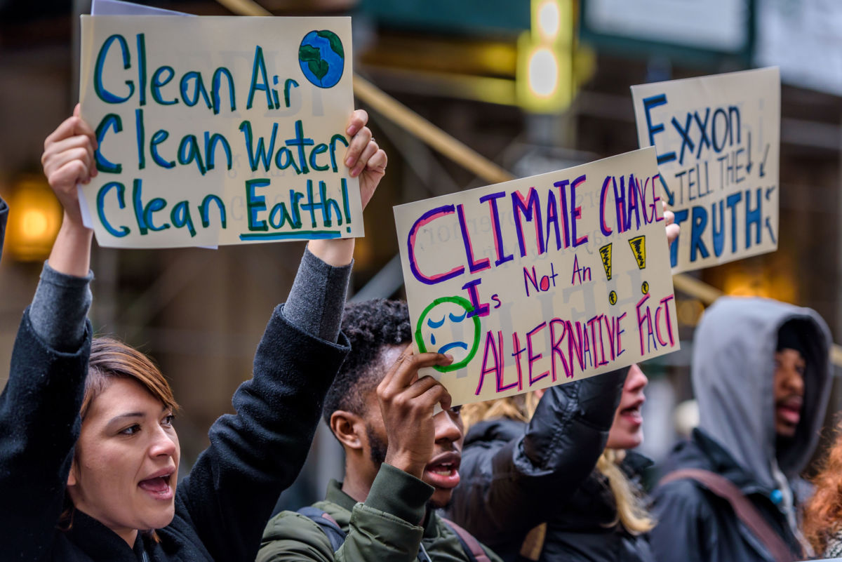 Activists hold a press conference in downtown Manhattan in support of an investigation of ExxonMobil