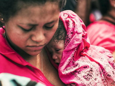 A migrant woman and her baby are detained by Mexican authorities in Tapachula, Mexico, on October 12, 2019.
