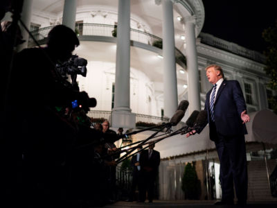 President Trump talks to members of the press on the South Lawn of the White House, August 23, 2019.