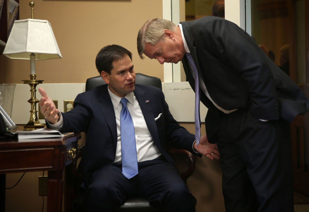 Sen. Marco Rubio, left, talks to Sen. Lindsey Graham prior to a news conference, July 24, 2014, on Capitol Hill in Washington, D.C. Rubio joins Graham as the latest addition to the Senate Climate Solutions Caucus.