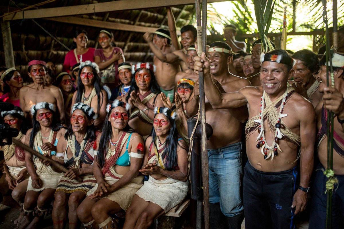 Waorani men and women participate in an assembly in ancestral Waorani territory, Pastaza, Ecuadorian Amazon.