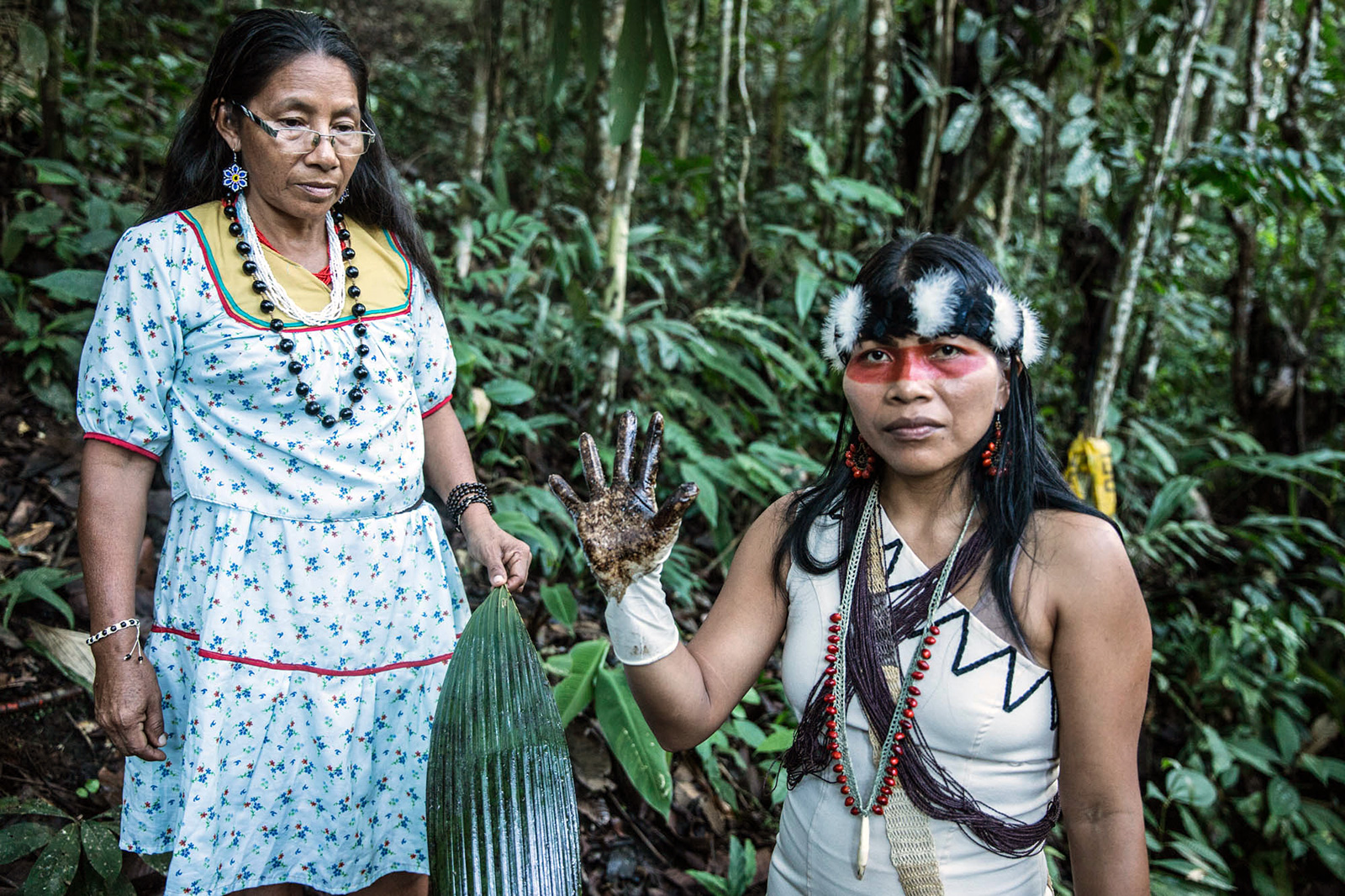 Waorani leader Nemonte Nenquimo shows evidence of oil contamination in the northern Ecuadorian Amazon rainforest.