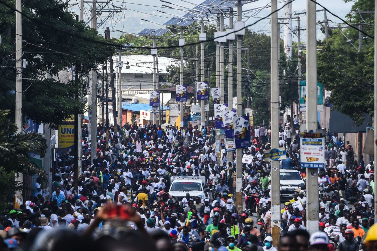 Protesters march on the street to demand the resignation of the Haitian president in Port-au-Prince, Haiti on October 13, 2019.