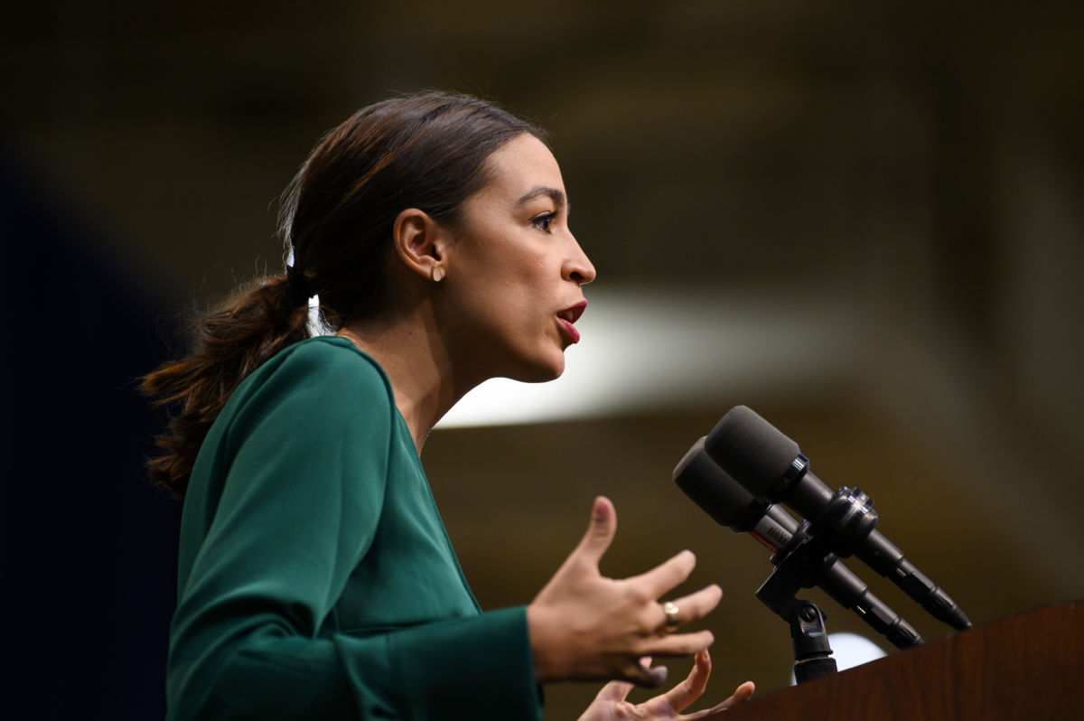 U.S. Rep. Alexandria Ocasio-Cortez (D-NY) takes the stage before speaking at the Climate Crisis Summit at Drake University on November 9, 2019, in Des Moines, Iowa.