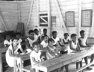 Chagossian children attend school in Peros Banhos, Chagos Archipelago, in this photo from the 1950s.