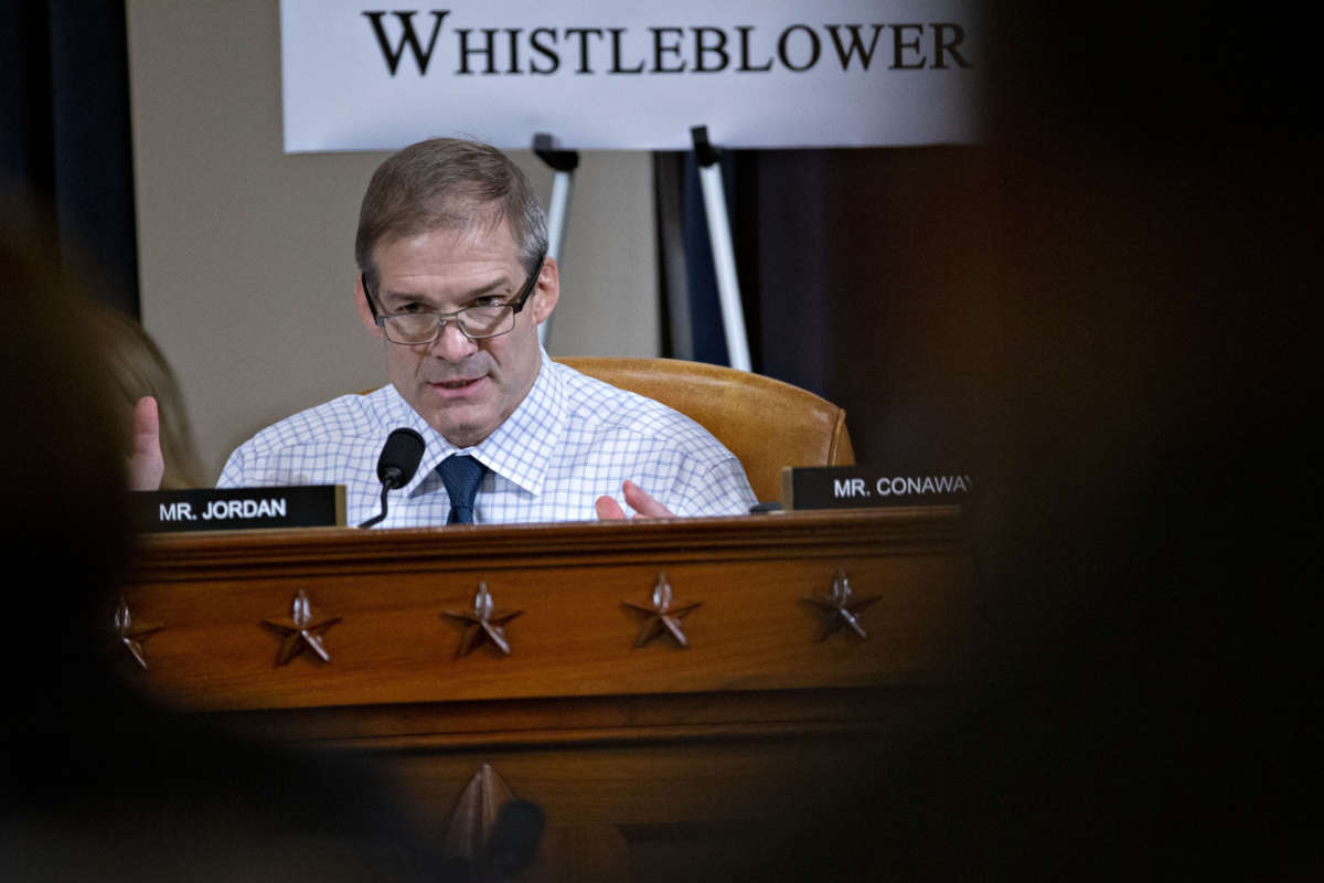 Rep. Jim Jordan speakis into a microphone while seated during a hearing