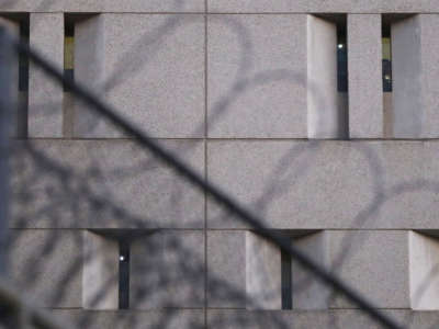 ICE detainees flash lights from cell windows from the upper floors of the Metropolitan Detention Center on June 14, 2018, in Los Angeles, California.