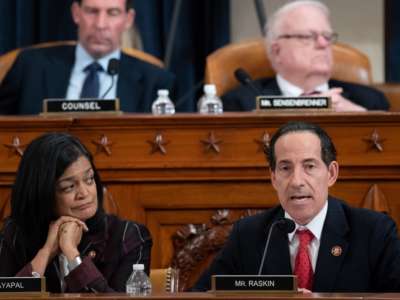 reps. Pramila Jayapal and Jamie Raskin sit at a podium during a hearing