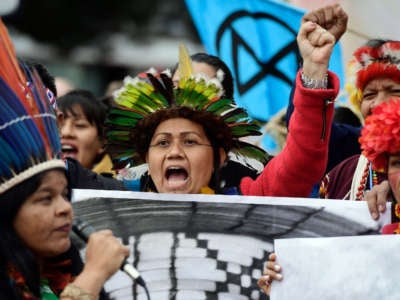 Indigenous people from Brazil take part in a demonstration demanding climate justice outside the venue of the UN Climate Change Conference COP25 in Madrid, on December 9, 2019.