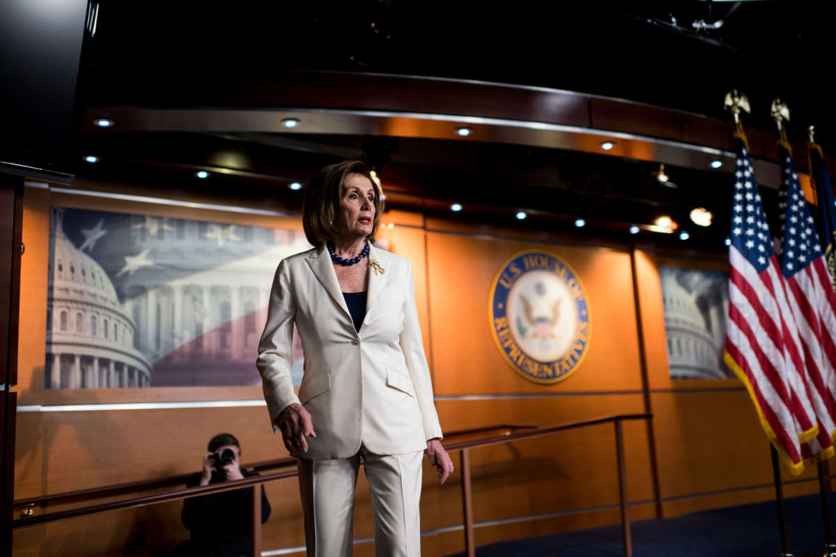 Nancy Pelosi stands alone