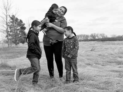 Madonna Sitting Bear is pictured with her children on April 4, 2019, in Mission, South Dakota.